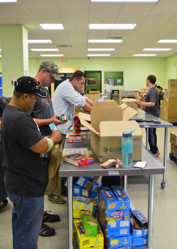 Team Dover Airmen sort more than 3,500 pounds of donated food July 6, 2015, at the Food Bank of Delaware in Milford, Del. The sorted food is distributed through a network of 550 hunger-relief programs including food closets, soup kitchens, daycares and shelters. (U.S. Air Force  photo/Airman 1st Class William Johnson)