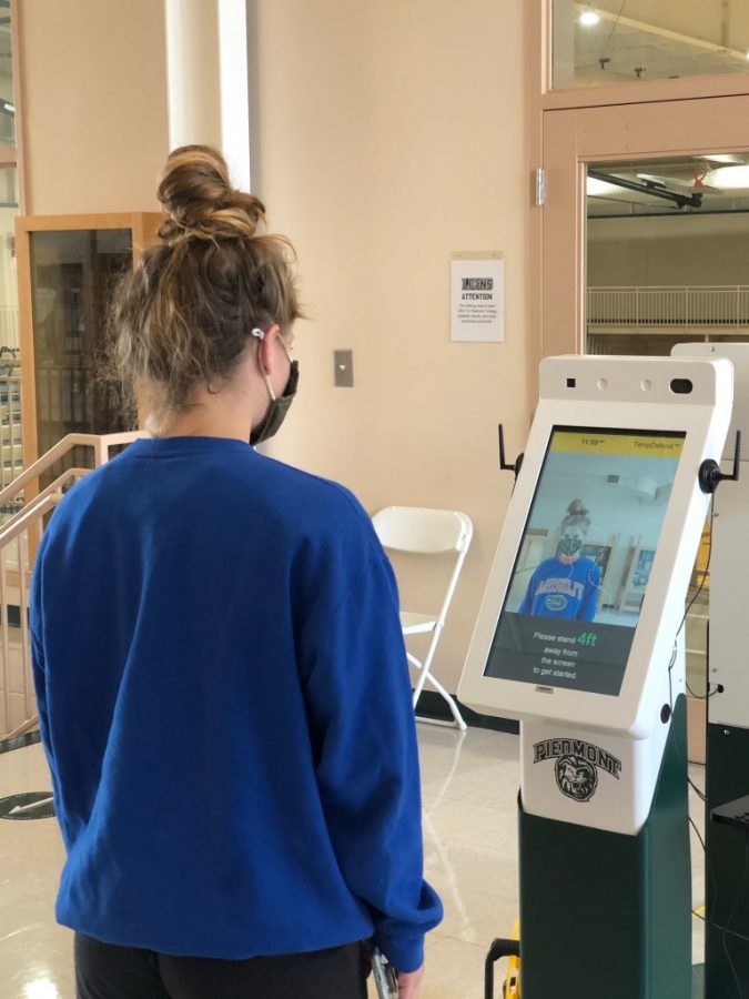 Beka Stegmayer, a senior exercise science major, gets her temperature checked before entering the Mize Center. This has become a normal practice for athletes to enter the Mize. // PHOTO BY NOAH AARON