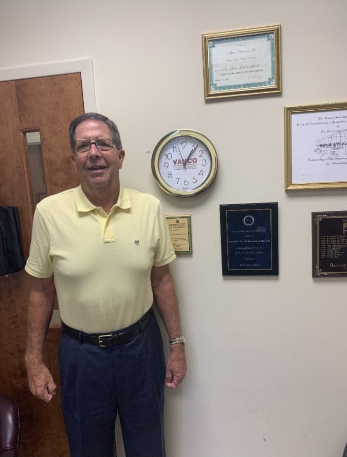 Dr. Dale Van Cantfort posing next to his Rotary award. // Photo Courtesy of Dr. Van Cantfort. 