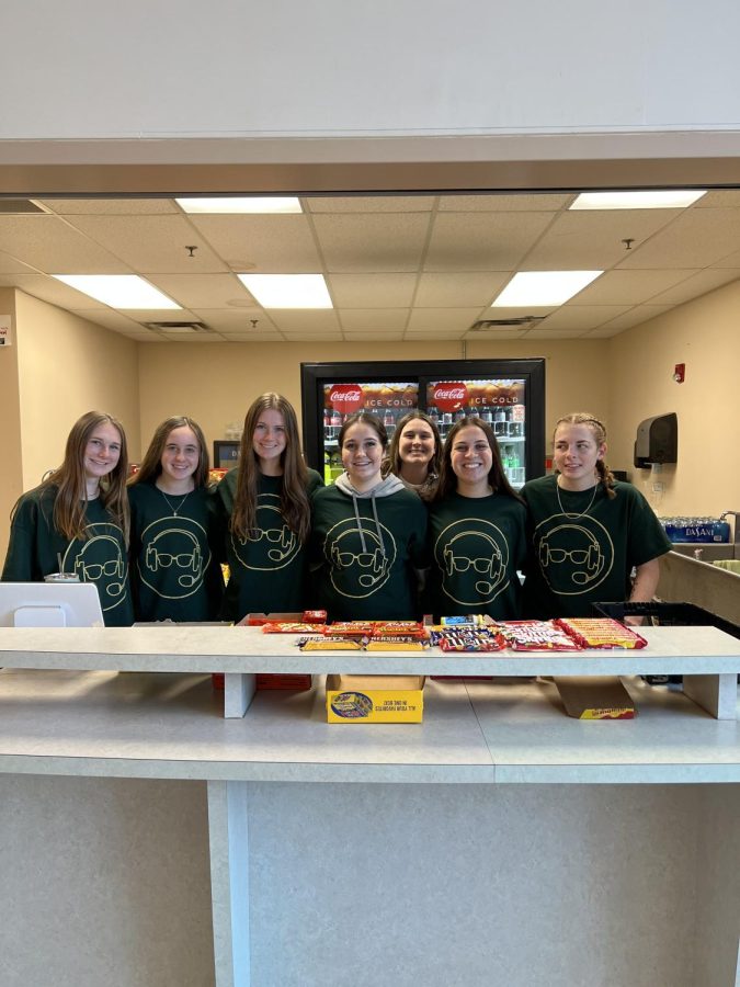 Piedmont womens soccer players and student workers working during the mens basketball game. 
PHOTO// Kelsey Skendziel