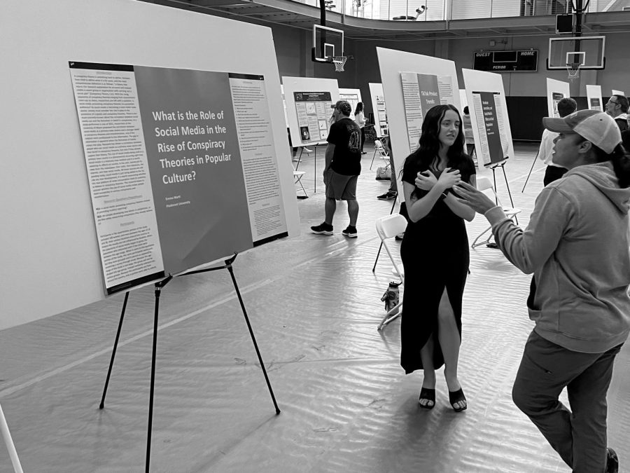 Former Piedmont University student, Emma Marti, discusses her research with fellow student, Toi Mekai-Watson, at the 2021 Piedmont Symposium PHOTO//Joe Dennis