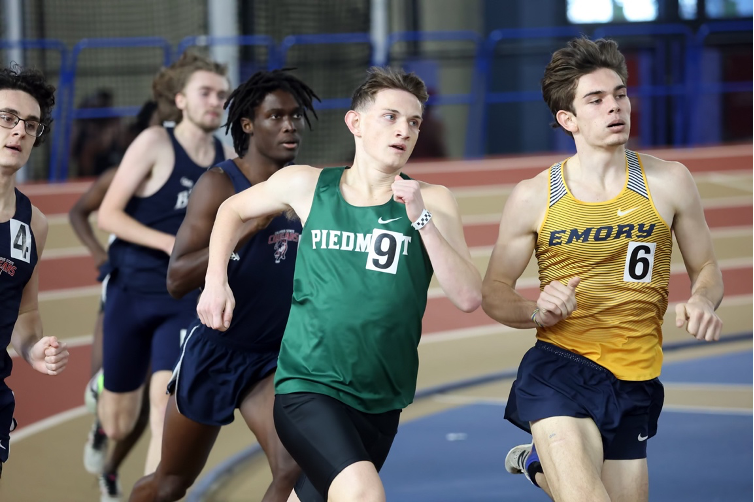 Cole Elrod attacks a turn during the indoor 800m race at the Birmingham Crossplex PHOTO//Piedmont University Athletics