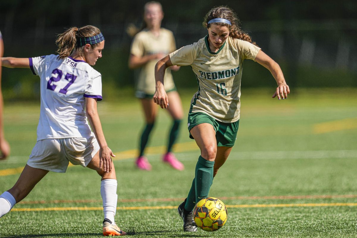 Senior Elissa Lotter dribbles past a defender. Lotter scored Piedmonts second goal against Agnes Scott, giving the Lady Lions a crucial 2-0 conference win.