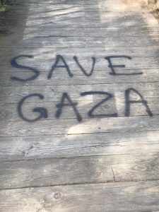 An image of one of the areas on the wooden bridge with the protest art SAVE GAZA done by unknown. PHOTO//NAHOMI SOLORZANO