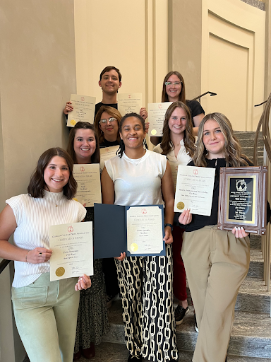 Award winners smile after receiving their awards from the Georgia College Press Association. 