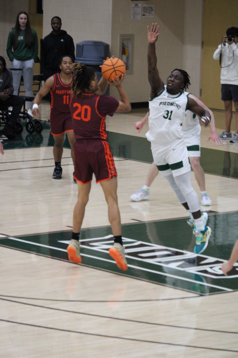 Senior forward Devin Dean leaps to get a block against Maryville and start a fast break for the Lions on Jan. 30. The Lions fell 86-59 in the conference game.