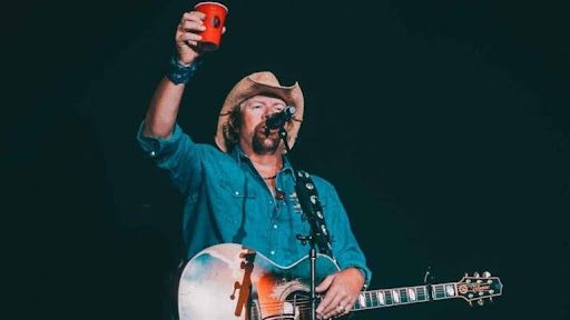 Toby Keith raises a toast at one of his concerts. 