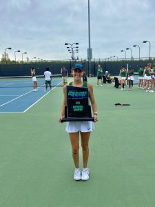 Piedmont University women’s tennis player Bri Laidman holds the 2023 Collegiate Conference of the South championship trophy.