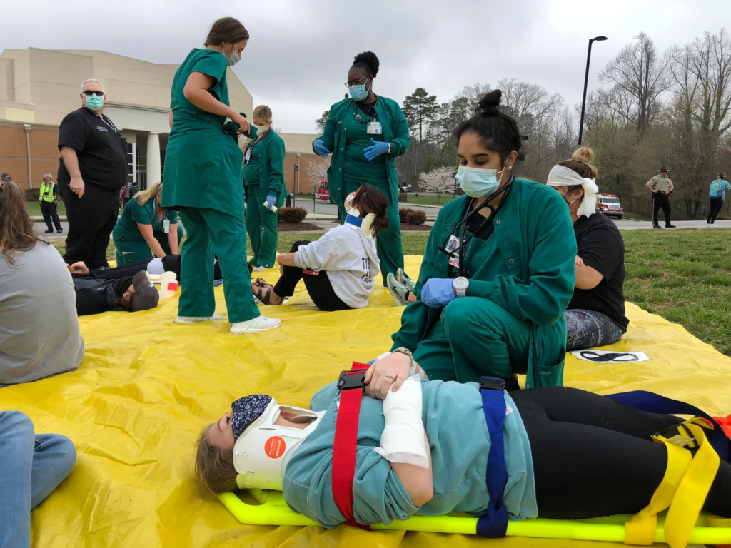 Nursing+students+are+seen+practicing+their+emergency+response+skills+during+the+disaster+drill+in+2021.