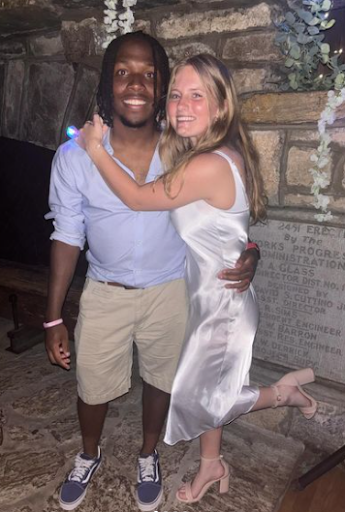 Senior Silas Sandles and Freshman Gretchen Dedolph pose together as the “bride and groom” of Piedmont’s Formal. 
