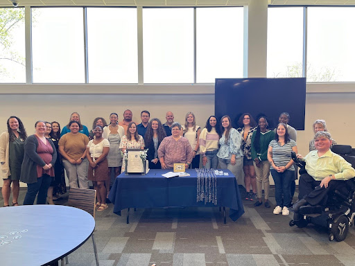 Student and faculty at the Spring 2024 Tri Alpha Honor Society induction ceremony.
