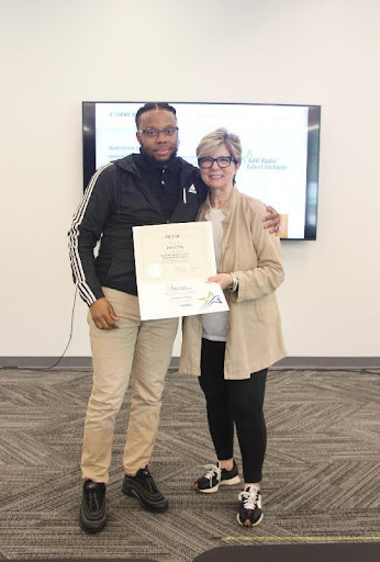 Piedmont student Jarrett Ray stands with Erica Farber after receiving his certificate in Radio Sales.