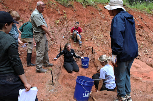 Bruce Willis and his students at the Anthropology camp in May.