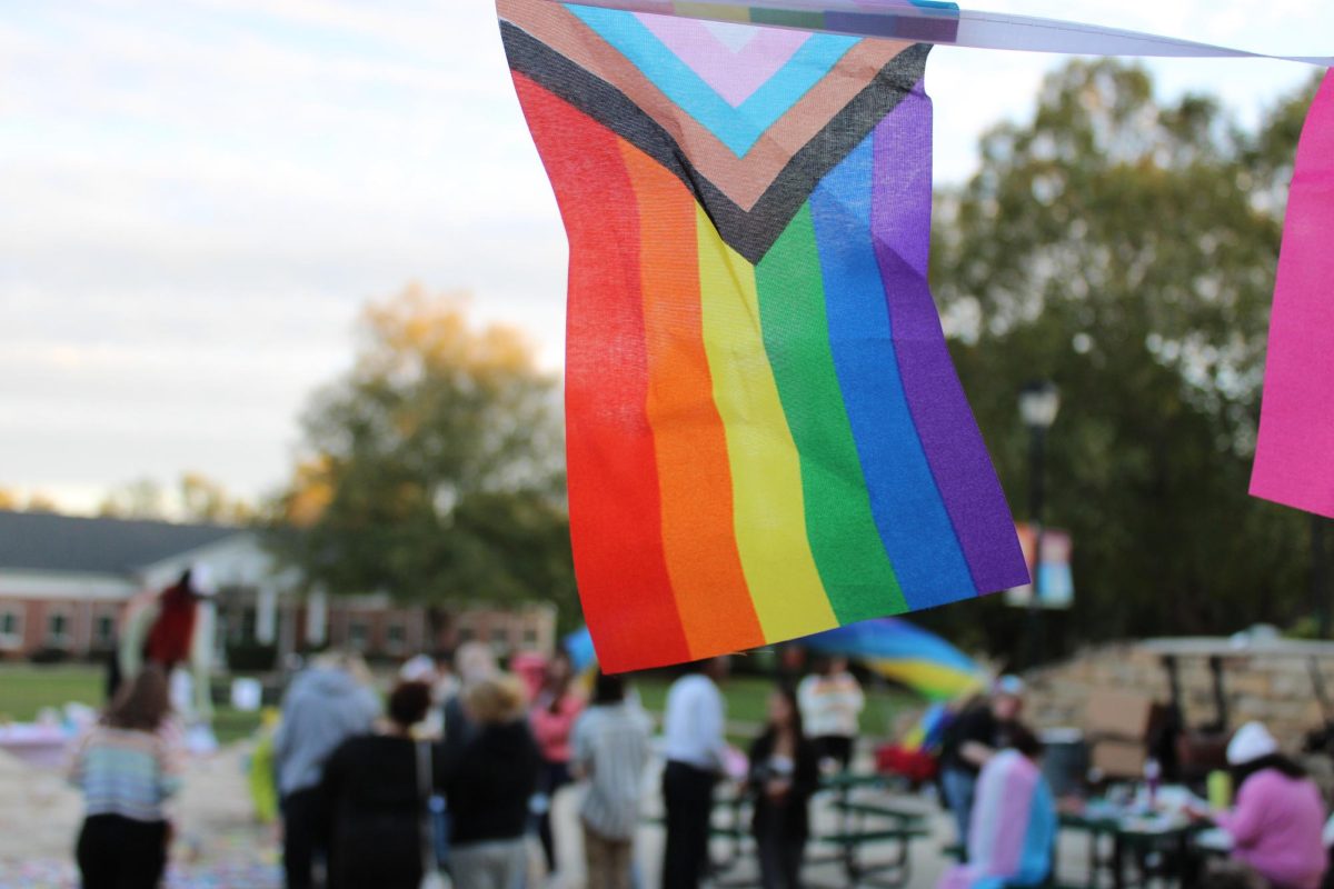 The Pride flag flying over Pride Walk event.