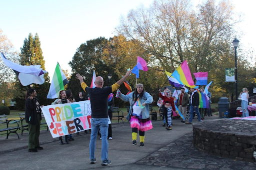 Theater professor Bill Gabelhausen leads students in a chant during the 2022 Pride Walk.