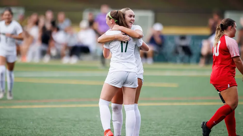 Juniors Paige Kluba and Sierra Judson after a goal at home. 