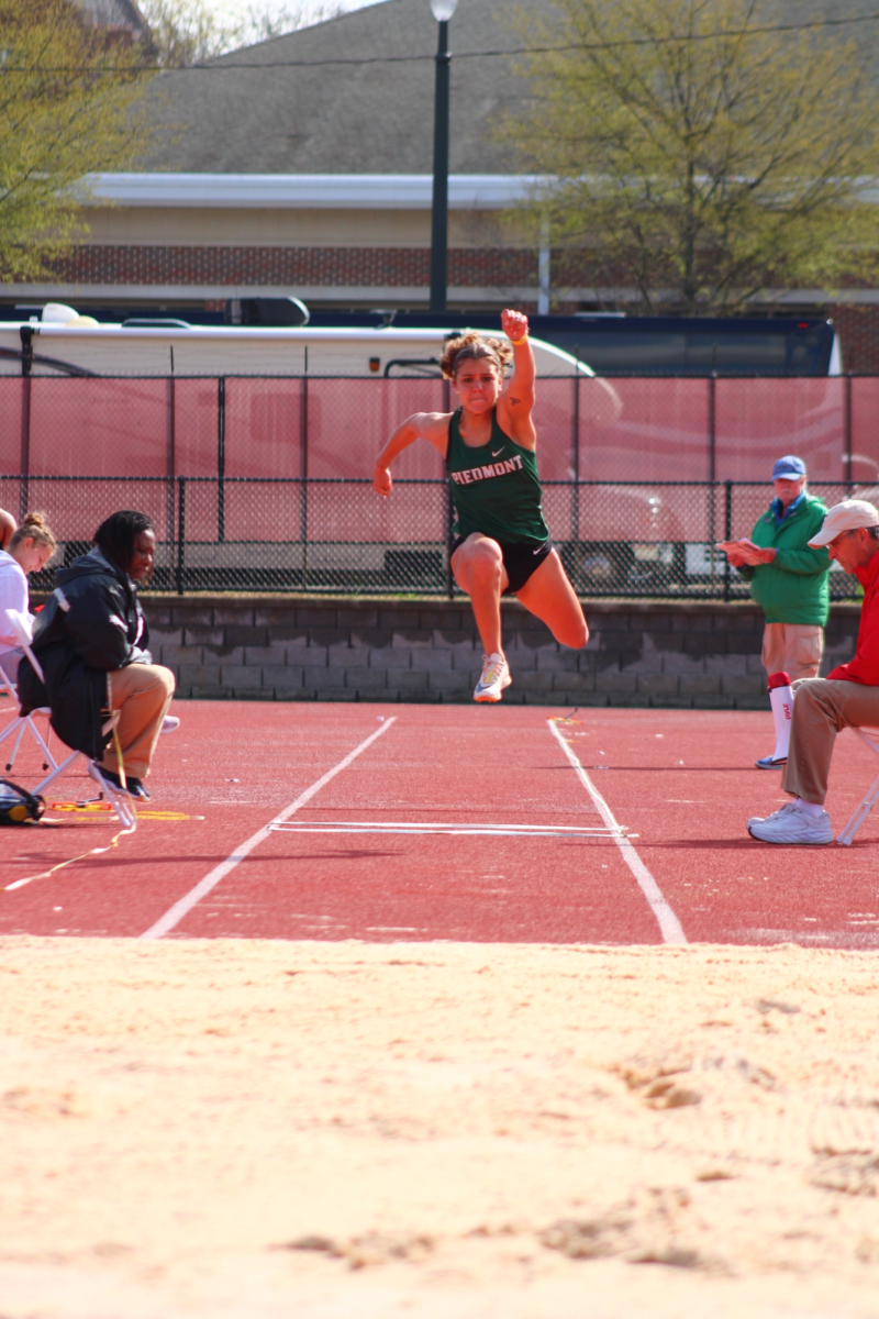 Senior Sam Seymour competes in the long jump. Although she didn't finish as a conference champion, the senior wrapped up her Piedmont career with three All-CCS team finishes.