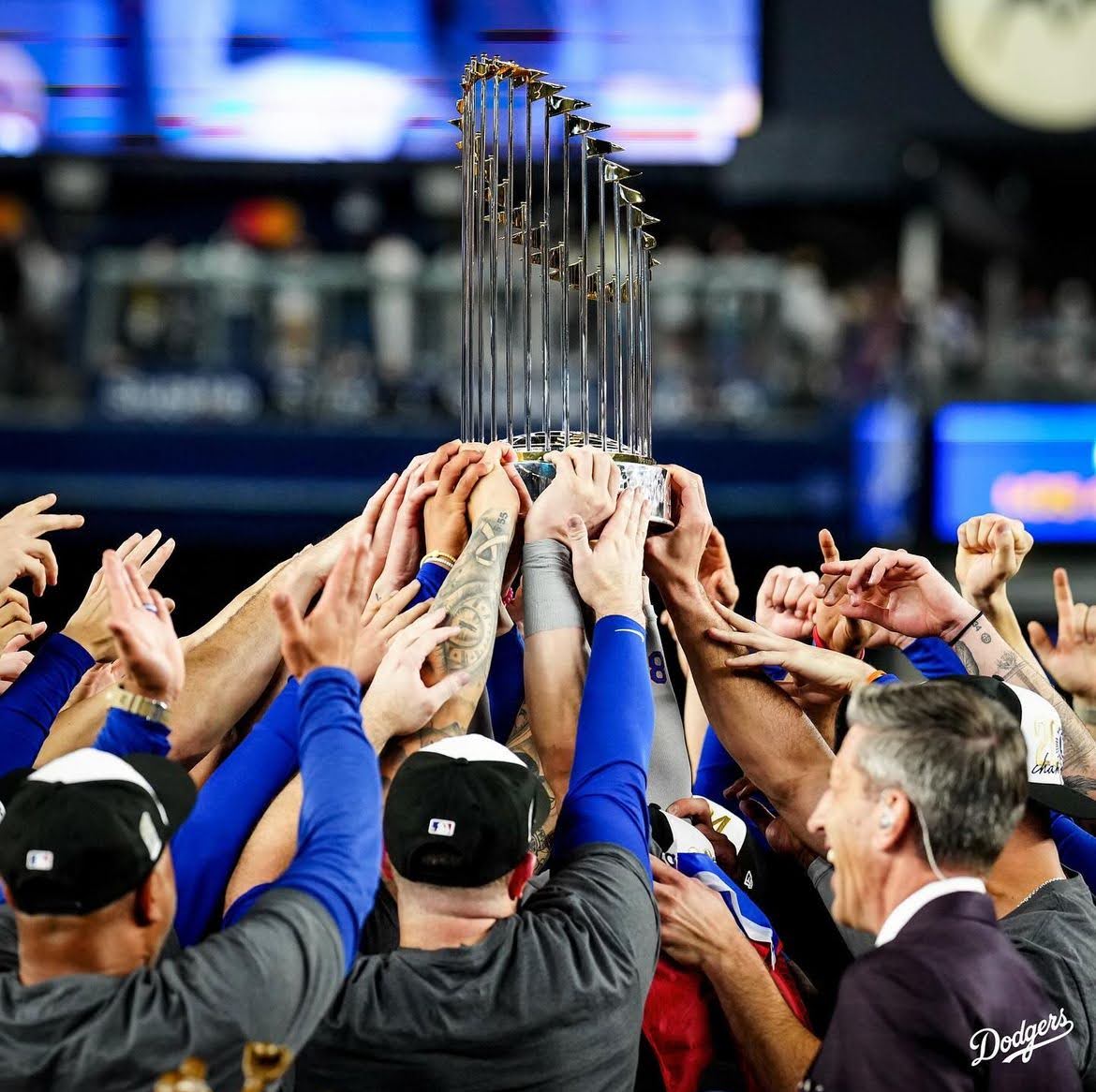 The Los Angeles Dodgers raising the World Series Trophy. 