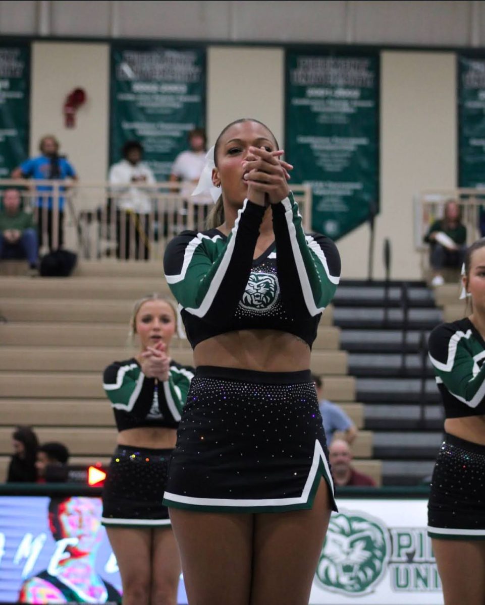 Senior Kiki Howard leading in cheer chant.