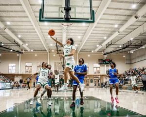 Bailey Wiseman shooting a lay-up against Johnson and Wales University.