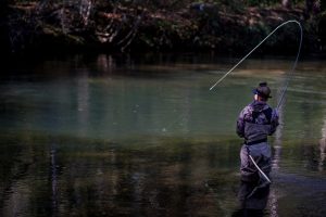 Angelica Lux fighting a fish on a fly rod on the Chattahoochee River in Helen. (Winged Reel Photography)