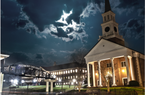 The bridge by Daniel Hall and the Music Conservatory on the campus of Piedmont University at night.