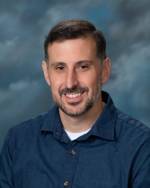 A headshot of Tristan Dyer.