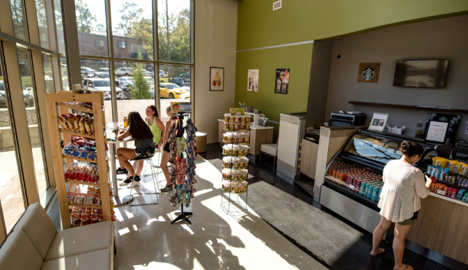 Students lounging at The Market, enjoying beverages and snacks.