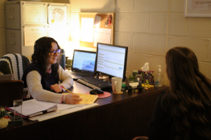 A portrait of Professor Sarah Smith advising senior Aleigha Carter for her upcoming spring semester.