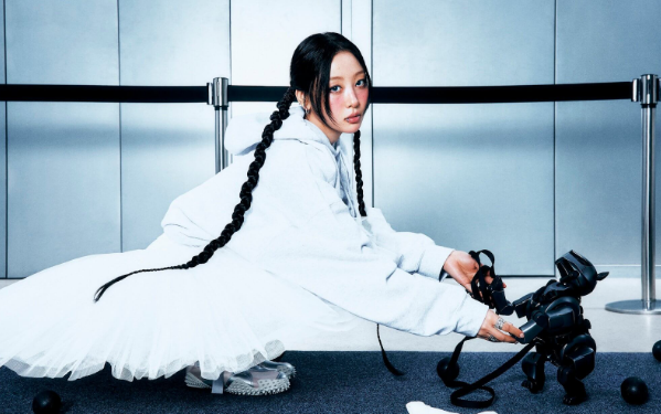 Yves encompassed by bright lighting, flouncy clothes and a dark robotic dog in concept pictures for her second mini-album, “Soft Error.”