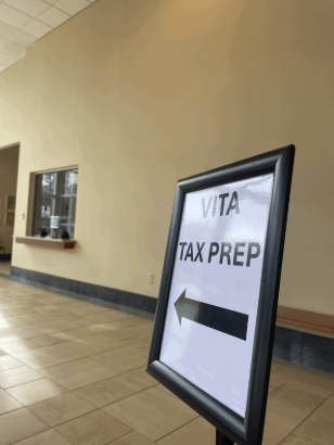 The first noticeable sign in the Swanson Center lobby points to the area where licensed Piedmont students can help with taxes.