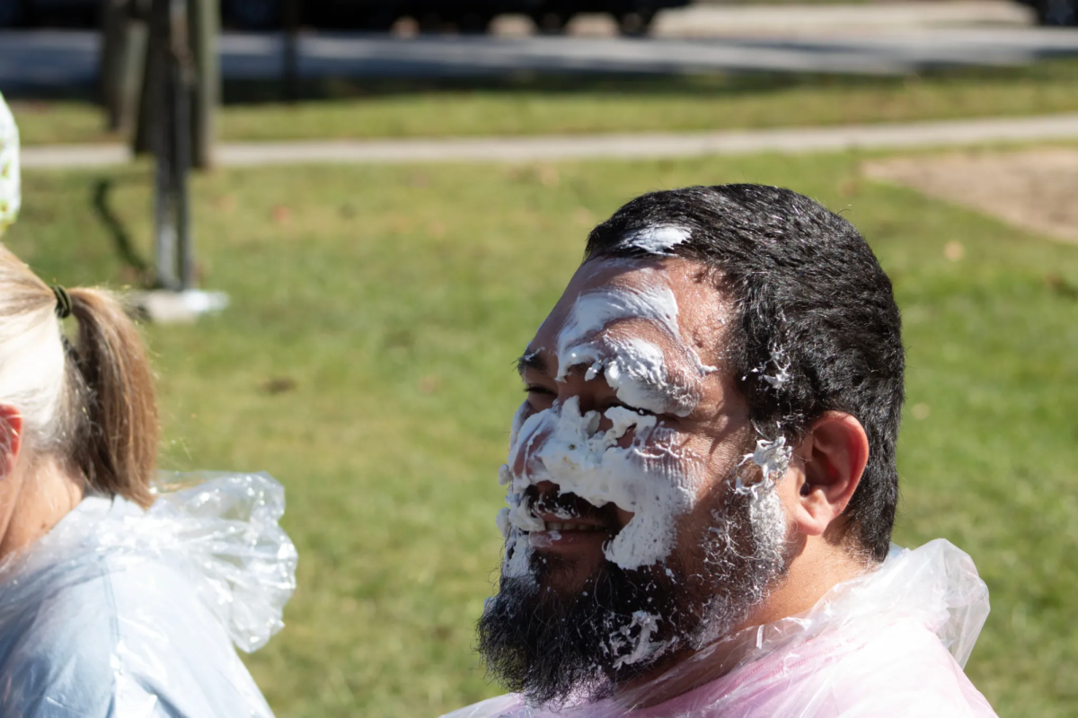 Dr. Joe Dennis reacting to a pie in the face. After a lot of trash talk, Dennis ate his words, and pie, being one of the most pied professors at the event.